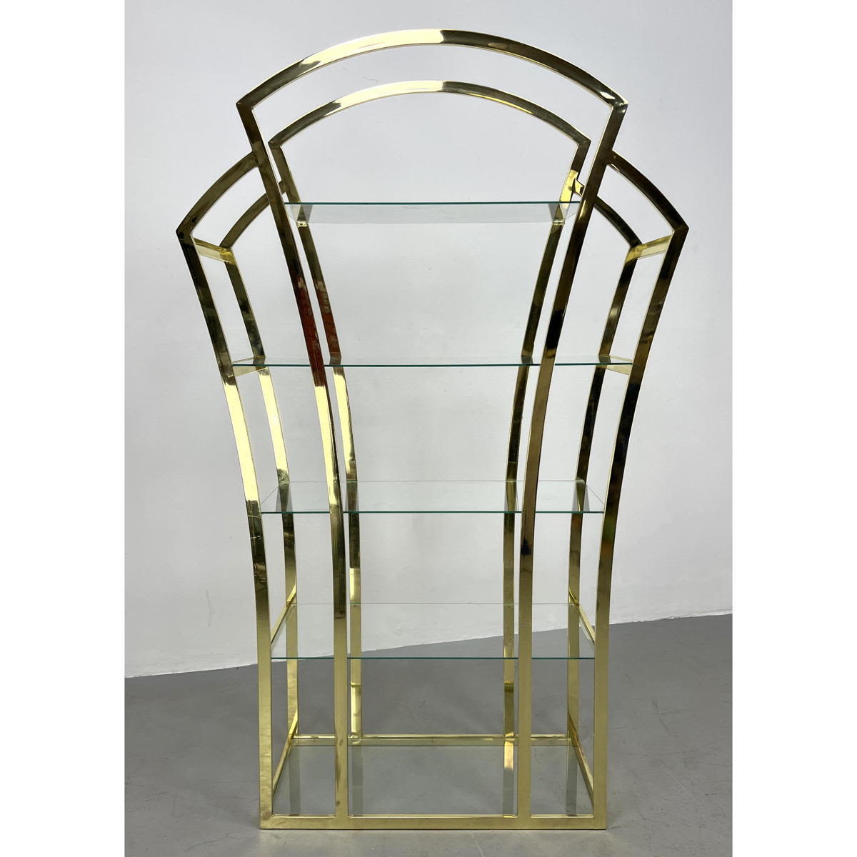 Appraisal: Brass Plated Arched Form Shelf Unit Glass Shelves DESIGN INSTITUTE