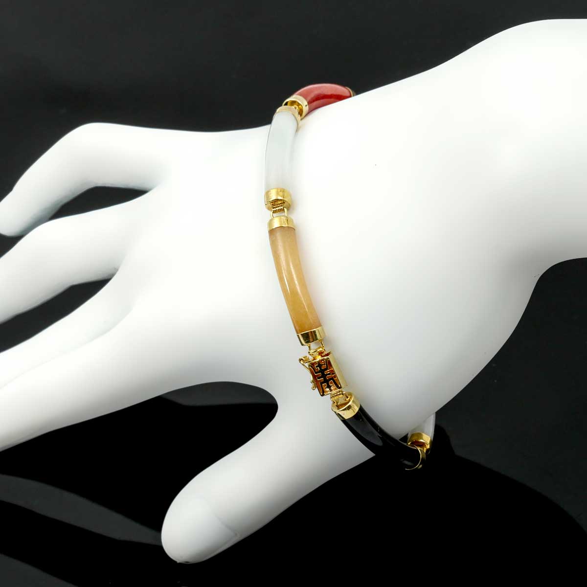 Appraisal: K JADE BRACELET K yellow gold with multi-colored nephrite jade