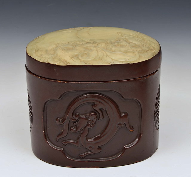 Appraisal: A CHINESE BROWN LACQUERED WOOD BOX and cover decorated with