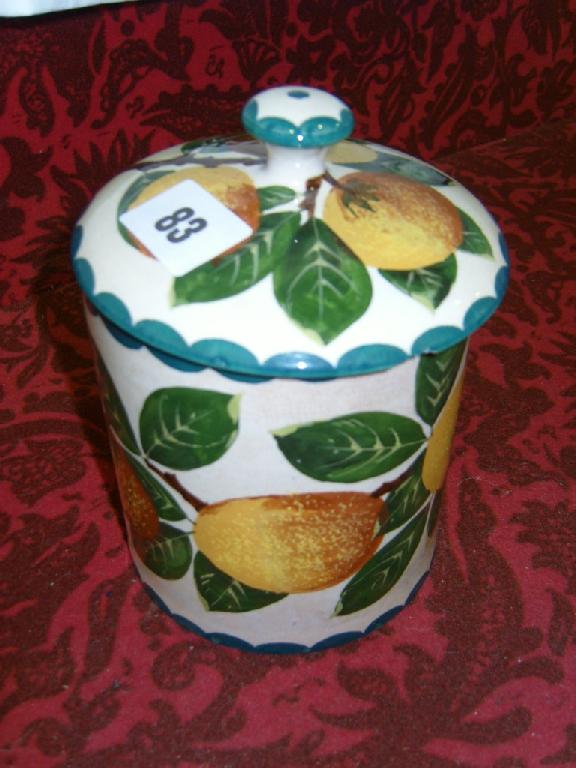 Appraisal: A Wemyss cylindrical pot and cover with painted orange branch