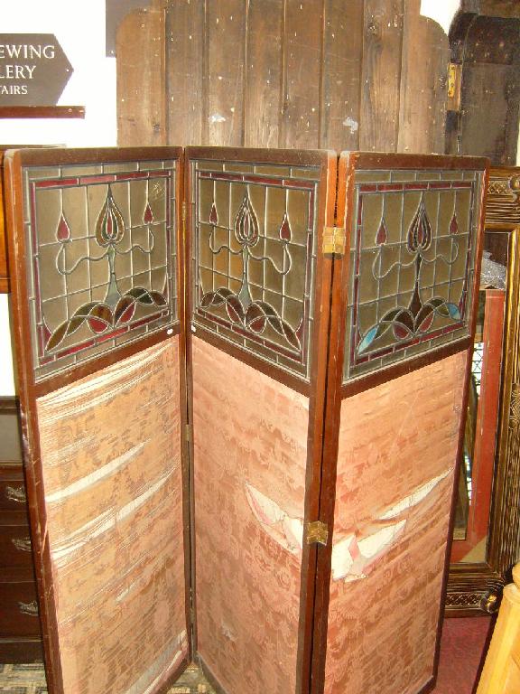 Appraisal: An Edwardian walnut famed -fold screen incorporating cloth panels of