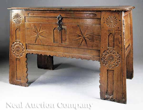 Appraisal: A Continental Baroque Carved Faux Bois Chest th c hinged