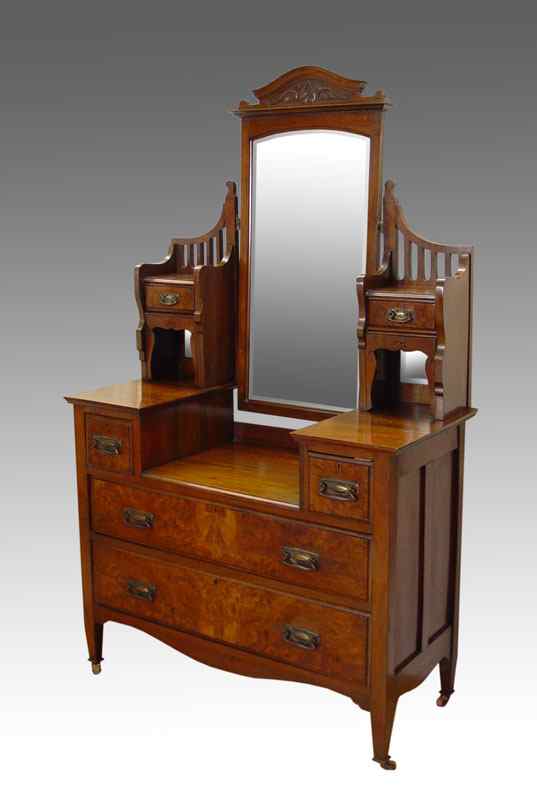 Appraisal: VICTORIAN DROP WELL DRESSER WITH MIRROR Swivel beveled mirror supported