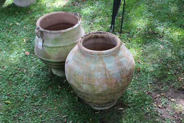 Appraisal: AN OVOID TERRACOTTA JAR with two lug handles high together