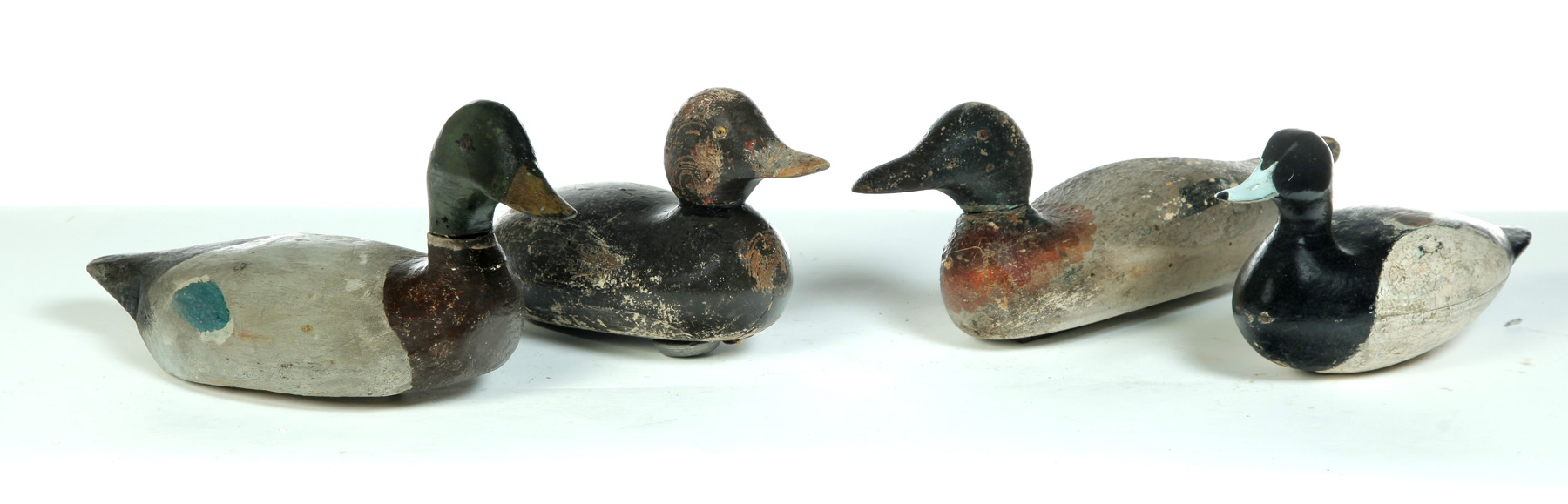 Appraisal: FOUR DUCK DECOYS American st half- th century Mallard h