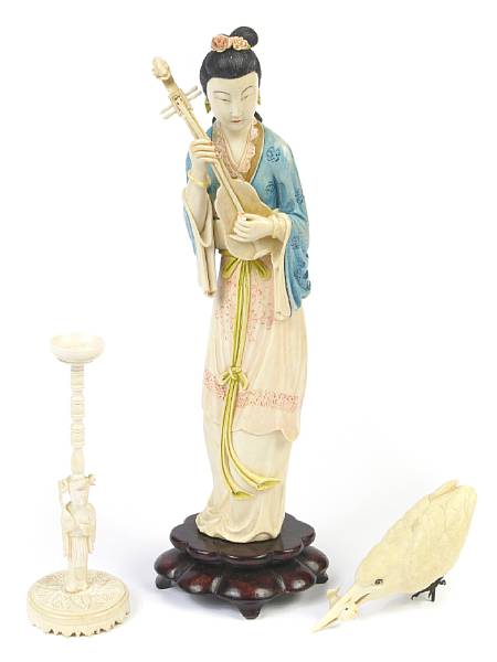 Appraisal: A tinted ivory Guanyin together with a carved ivory bird