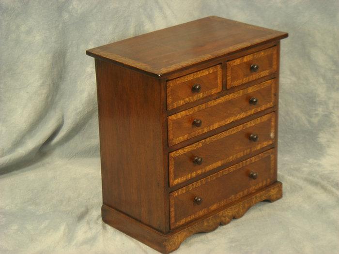 Appraisal: Georgian mahogany miniature chest of drawers top and drawer fronts