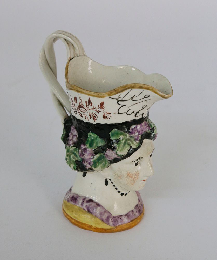 Appraisal: th Century English Staffordshire Female Toby Jug th Century English