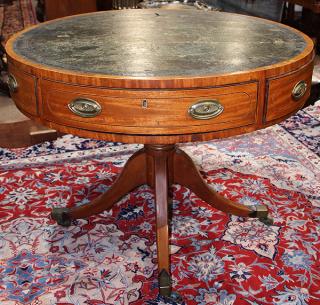 Appraisal: Regency satinwood rent table having a circular embossed leather top