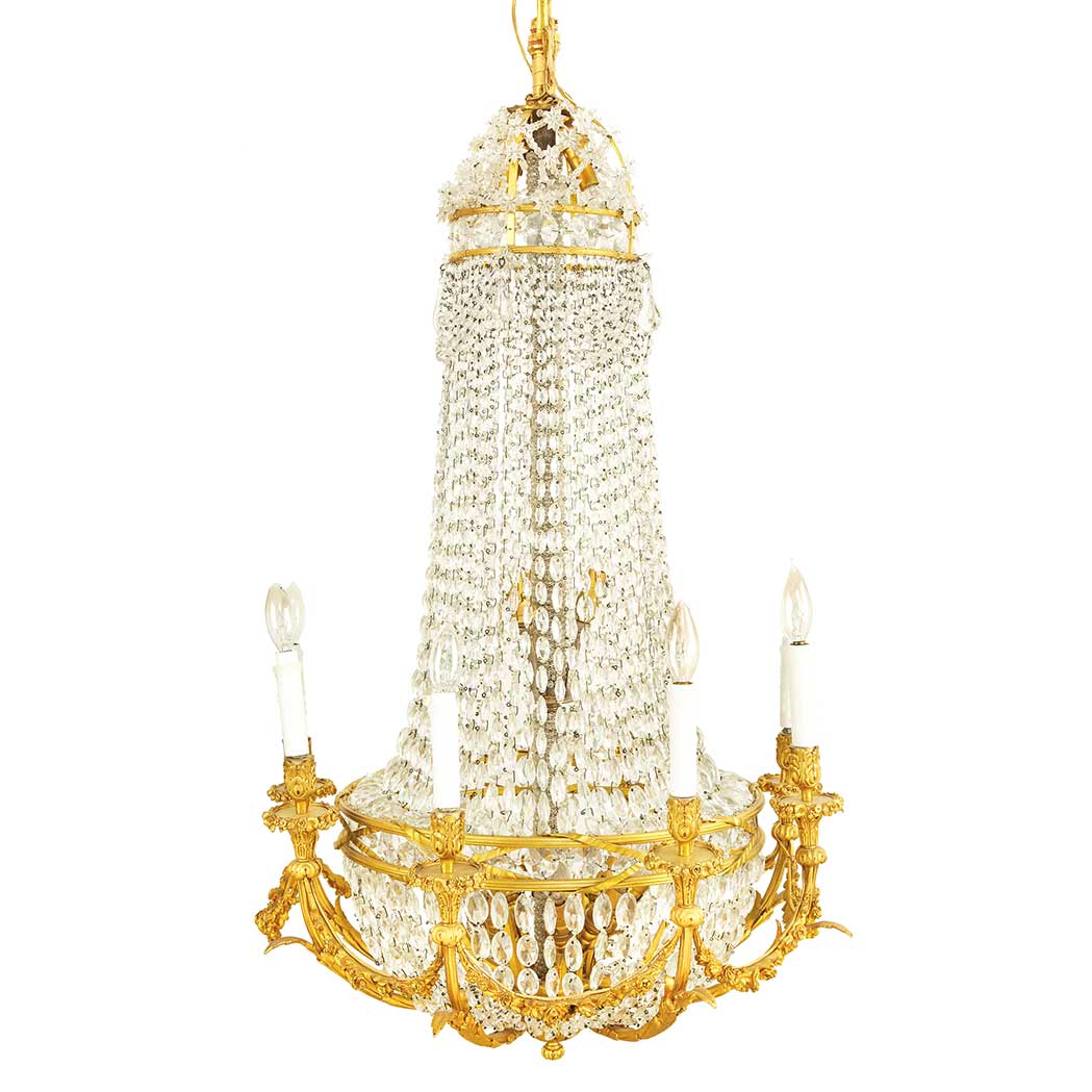 Appraisal: Louis XVI Style Gilt-Bronze Sixteen-Light Chandelier Each leaf cast curved