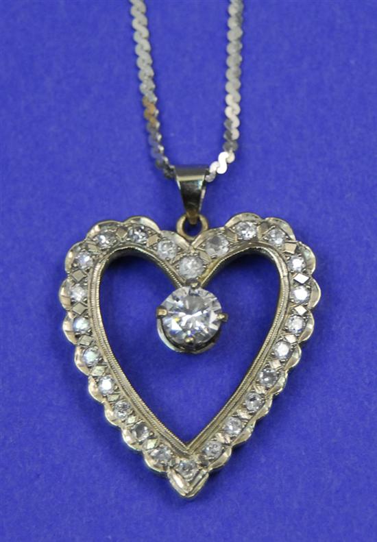 Appraisal: WHITE GOLD AND DIAMOND HEART PENDANT on an K white