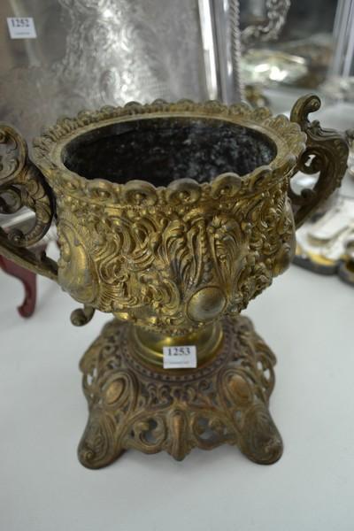 Appraisal: A BRASS TWIN HANDLED URN