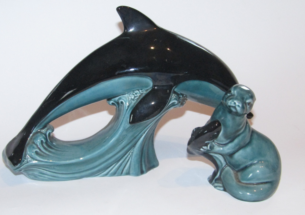 Appraisal: A thC Poole Pottery figure of a leaping dolphin in