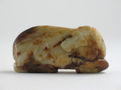 Appraisal: A Chinese jade carving of a recumbent horse the stone