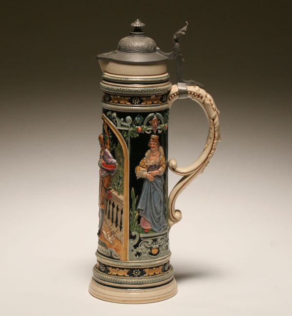 Appraisal: Large German stein with embossed medieval figures extensive raised and