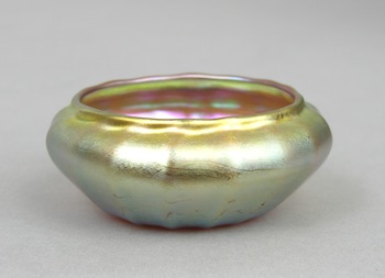 Appraisal: A Gold Iridescent Quezal Salt Dish A lovely Gold iridescent