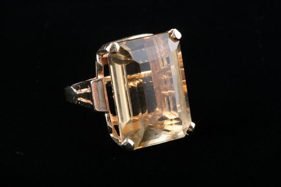 Appraisal: K YELLOW GOLD AND CITRINE RING Emerald-cut citrine weighing approx