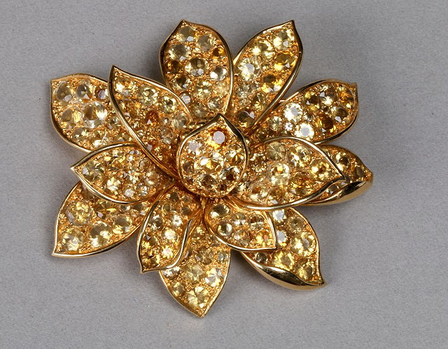 Appraisal: A CITRINE SET FLOWER BROOCH each petal pave set with