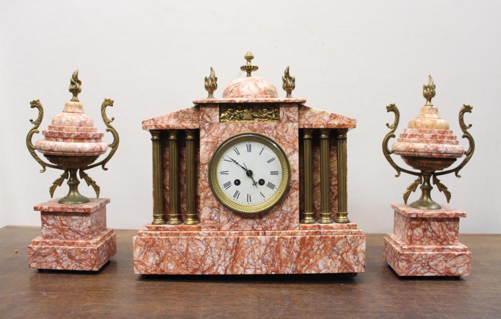 Appraisal: THREE-PIECE ROSE MARBLE CLOCK SET French th century classic architectural