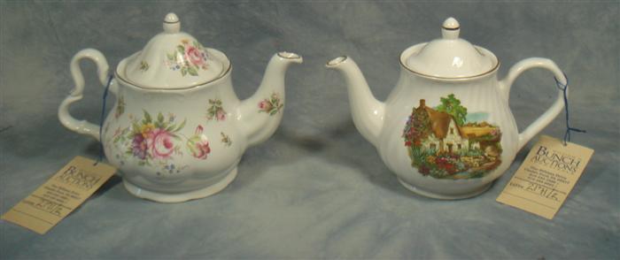 Appraisal: English porcelain teapots Royal Cauldon Arthur Wood tall Estimate -