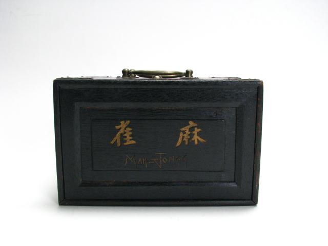 Appraisal: Carved and Painted Ivory Mah-Jongg Set in black painted wood