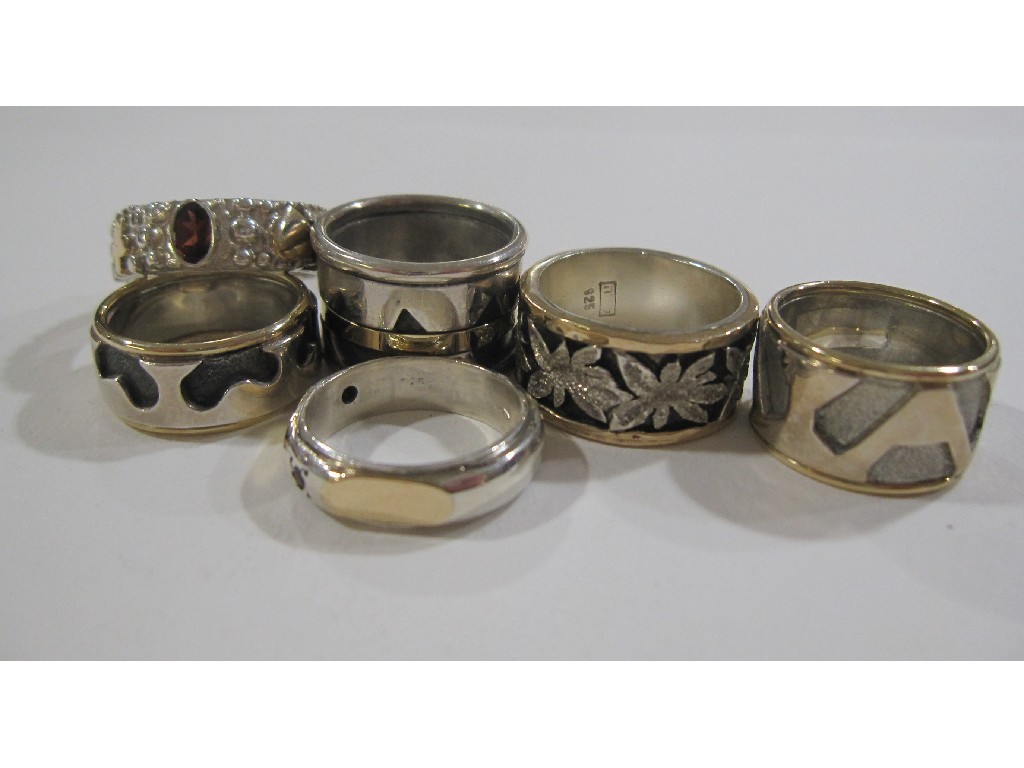 Appraisal: Six silver dress rings with gold onlay