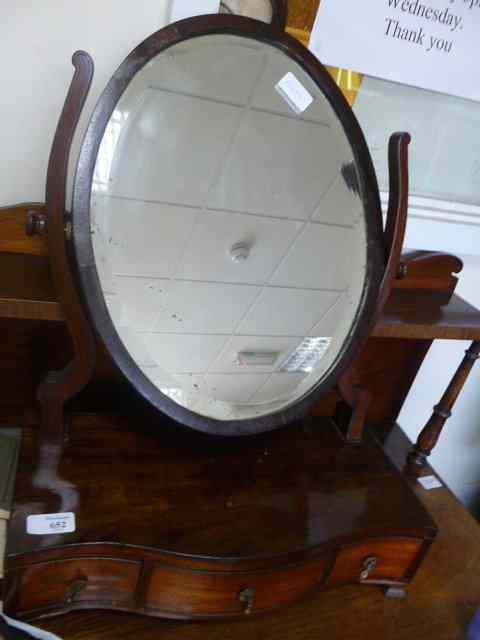 Appraisal: A GEORGIAN STYLE MAHOGANY DRESSING TABLE MIRROR the oval swing