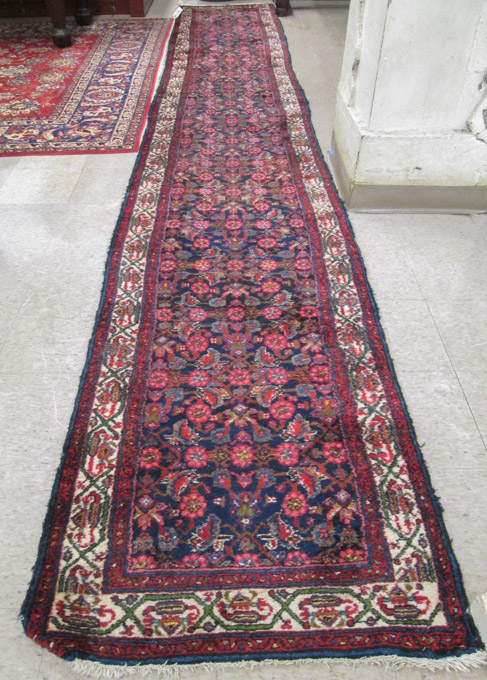 Appraisal: SEMI-ANTIQUE PERSIAN HAMADAN RUNNER hand knotted in an overall Herati