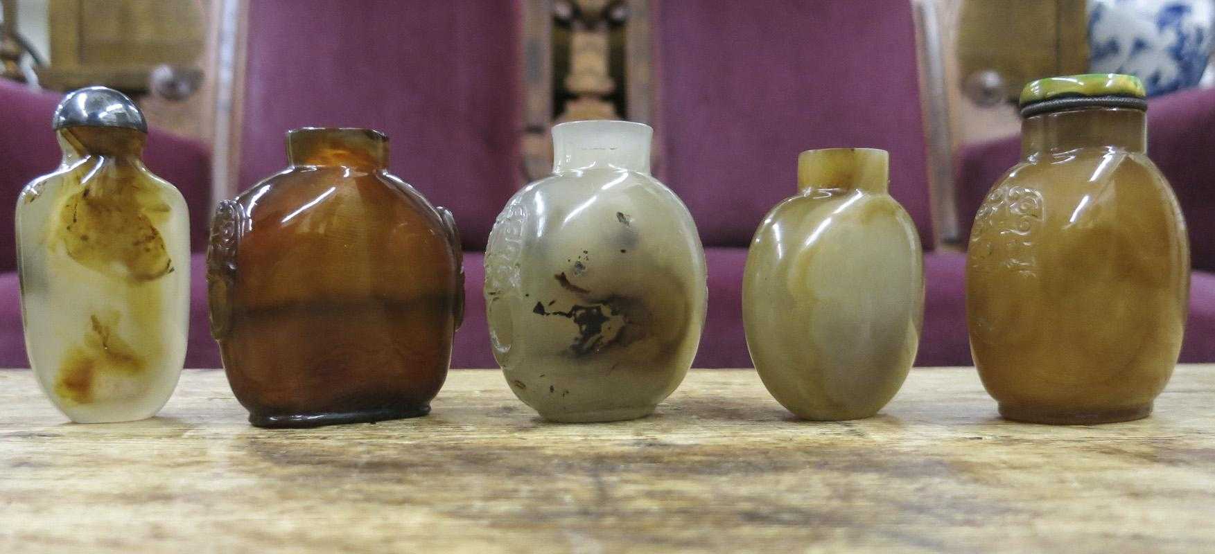 Appraisal: FIVE CHINESE CARVED AGATE SNUFF BOTTLES of compressed forms with