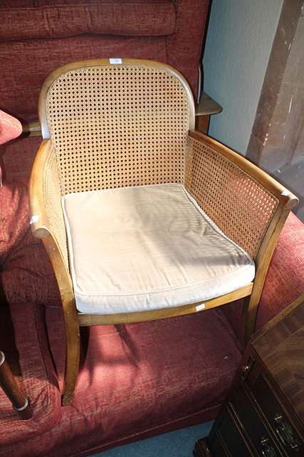 Appraisal: A MAHOGANY AND BERGERE ARMCHAIR