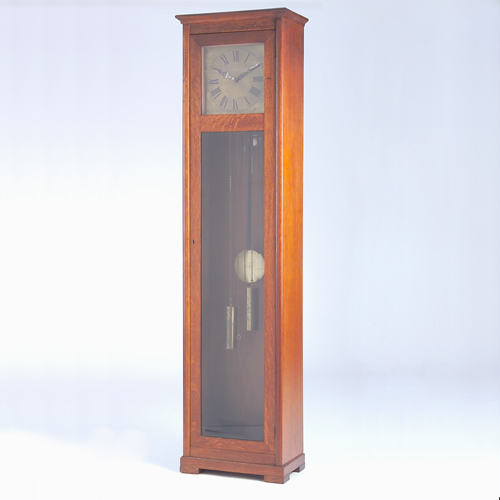 Appraisal: COLONIAL MFG CO Tall clock with brass face and beveled