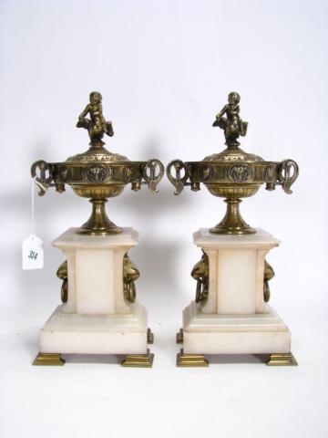 Appraisal: Pair of alabaster and brass urns with figural lid finials