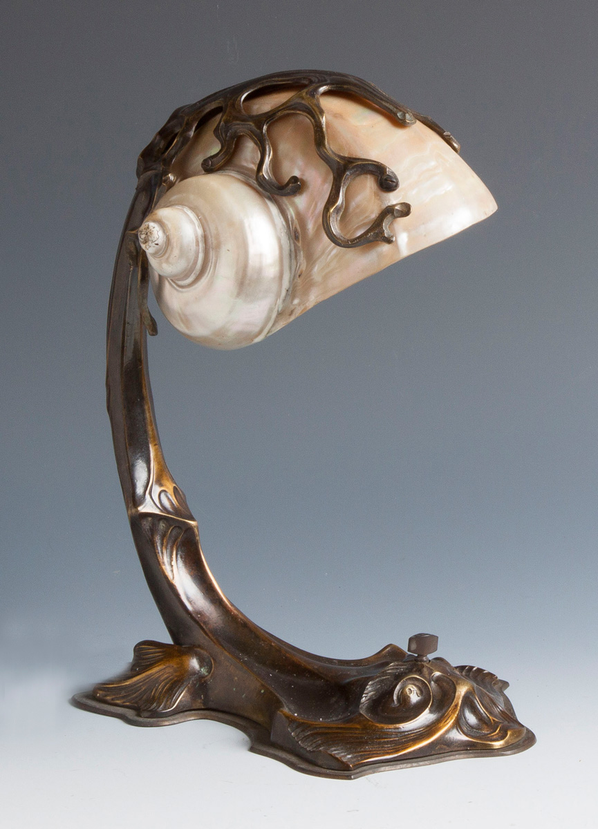 Appraisal: Art Nouveau Desk Lamp Nautilus shell shade patinaed metal base