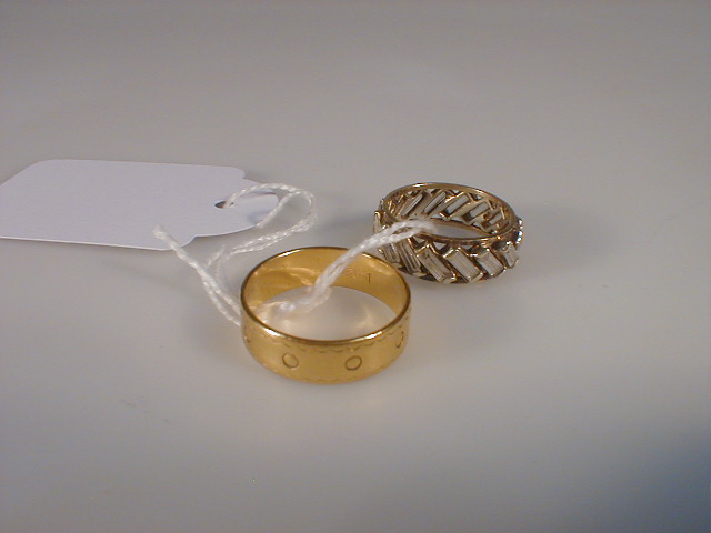 Appraisal: A ct gold wedding band g together with a dress