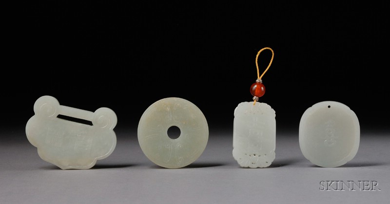 Appraisal: Four Jade Carvings China th century pendants including a lock