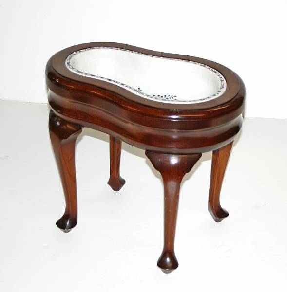 Appraisal: An Italian majolica bidet basin on later walnut base height