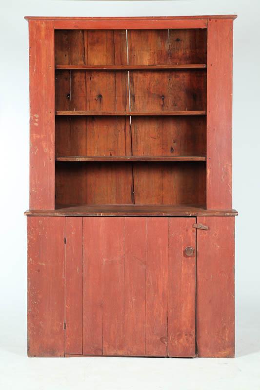 Appraisal: CUPBOARD American th century pine Red-painted one-piece slant-back open top