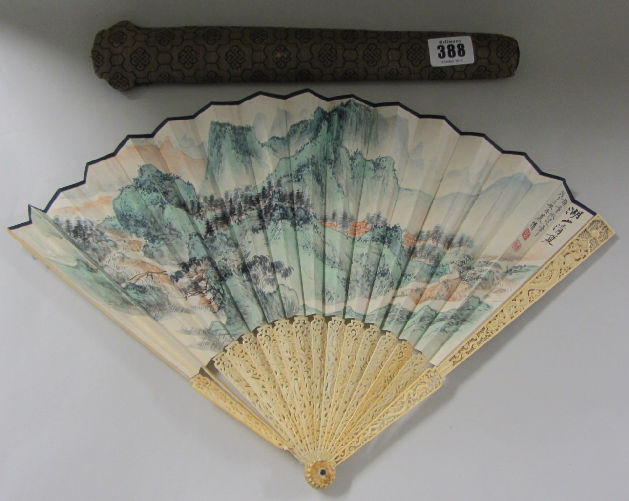 Appraisal: A Canton ivory fan with paper leaf circa the sticks