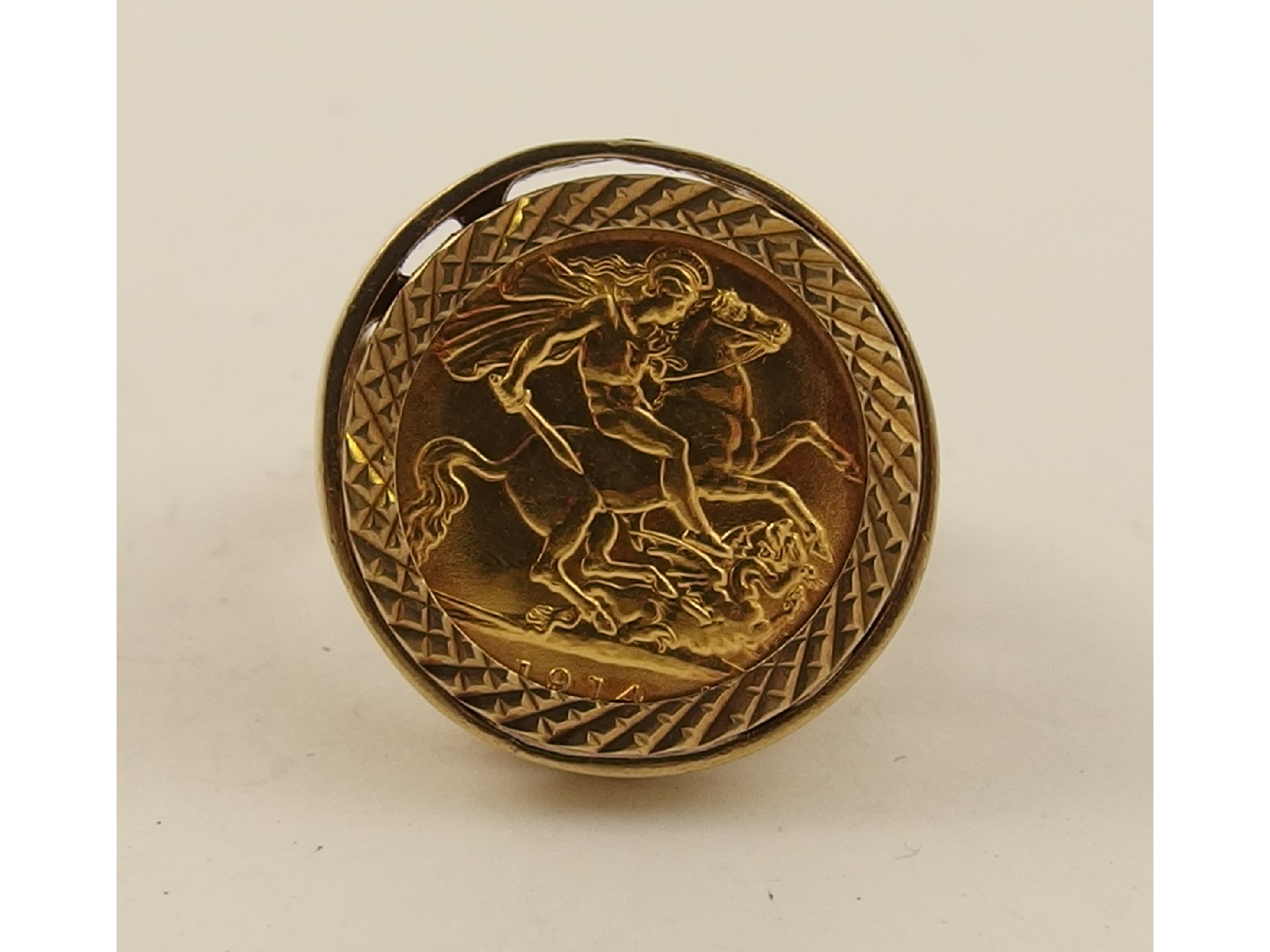 Appraisal: A half sovereign in a ct ring mount total weight