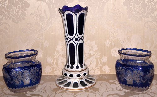 Appraisal: Title Three Bohemian Blue Cut-Back Glass vases two matched oval