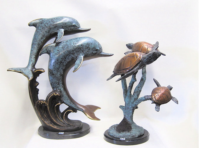 Appraisal: TWO MARINE WILDLIFE BRONZE SCULPTURES a marbleized polychrome enamel of