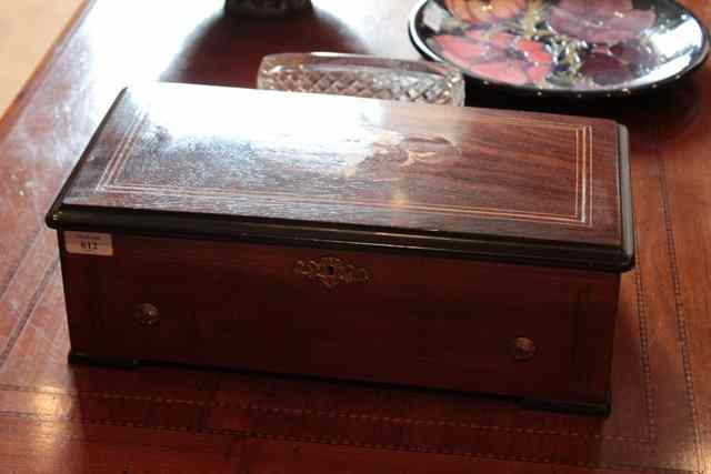 Appraisal: A TH CENTURY CONTINENTAL WALNUT CASED MUSICAL BOX with floral