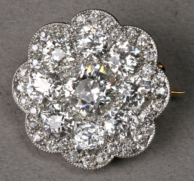 Appraisal: AN EDWARDIAN DIAMOND SET CIRCULAR BROOCH with bead set old