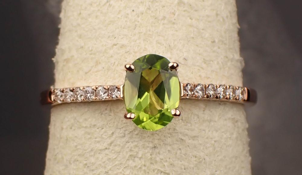 Appraisal: PERIDOT DIAMOND AND FOURTEEN KARAT ROSE GOLD RING with six