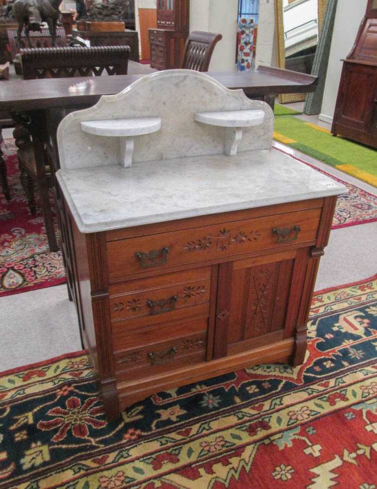 Appraisal: A VICTORIAN MARBLE-TOP WASHSTAND COMMODE Charles Eastlake design American c