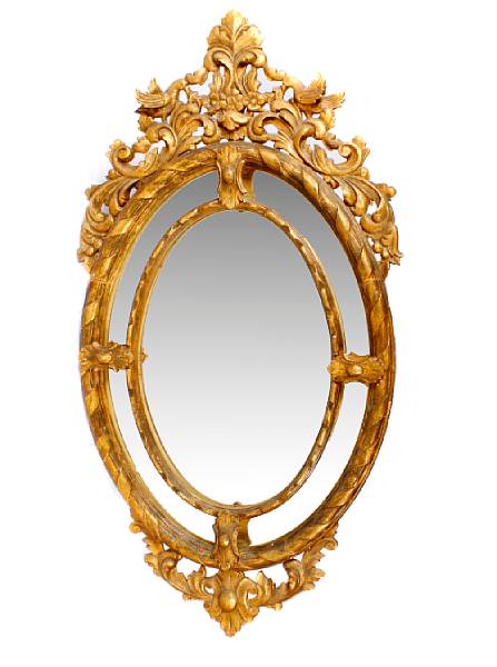 Appraisal: A pair of gilt framed oval wall mirrors height in