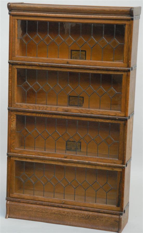 Appraisal: FOUR SECTION GLOBE-WERRICKE BOOKCASE With leaded glass doors cracked