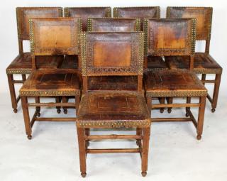 Appraisal: Set of tooled leather dining chairs with brass detailing h