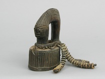 Appraisal: A Yoruba Wooden Rattle A Yoruba rattle carved in a