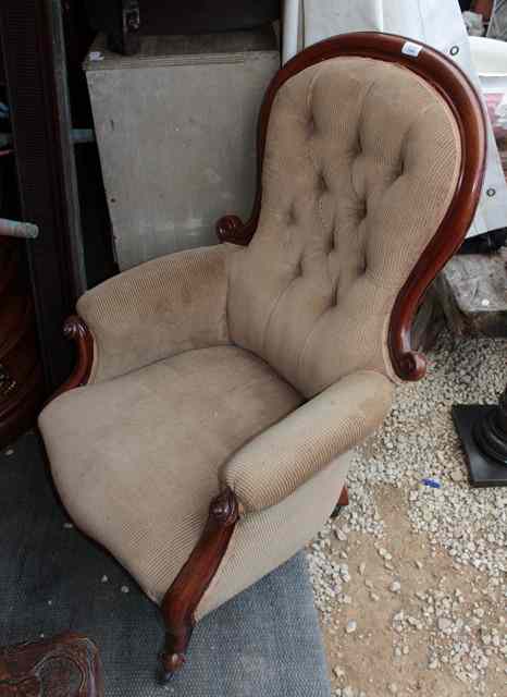 Appraisal: A VICTORIAN MAHOGANY ARMCHAIR with scroll back serpentine front and